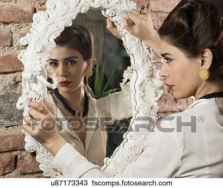 holding Vintage mirror woman